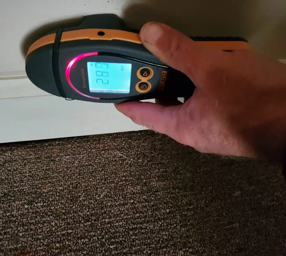Moisture detection at baseboard during Storm Damage Restoration in Ohio